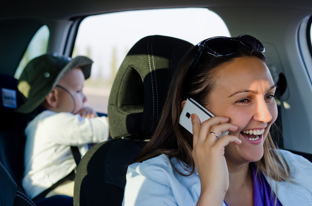talking on phone with chld in the car.jpg